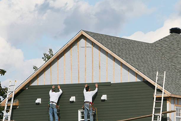 Professional Storm Damage Siding Repair technician working in Fredericktown, PA